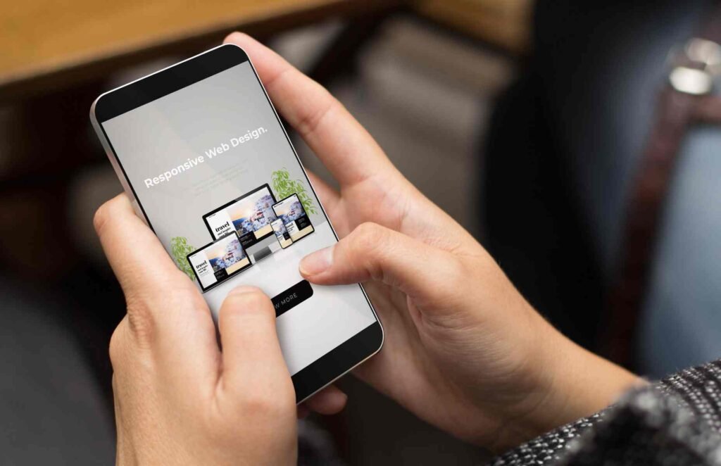 A smartphone displaying a modern, responsive website in a person’s hand.